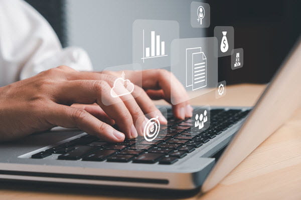 Financial Resources - person typing on laptop with available resources