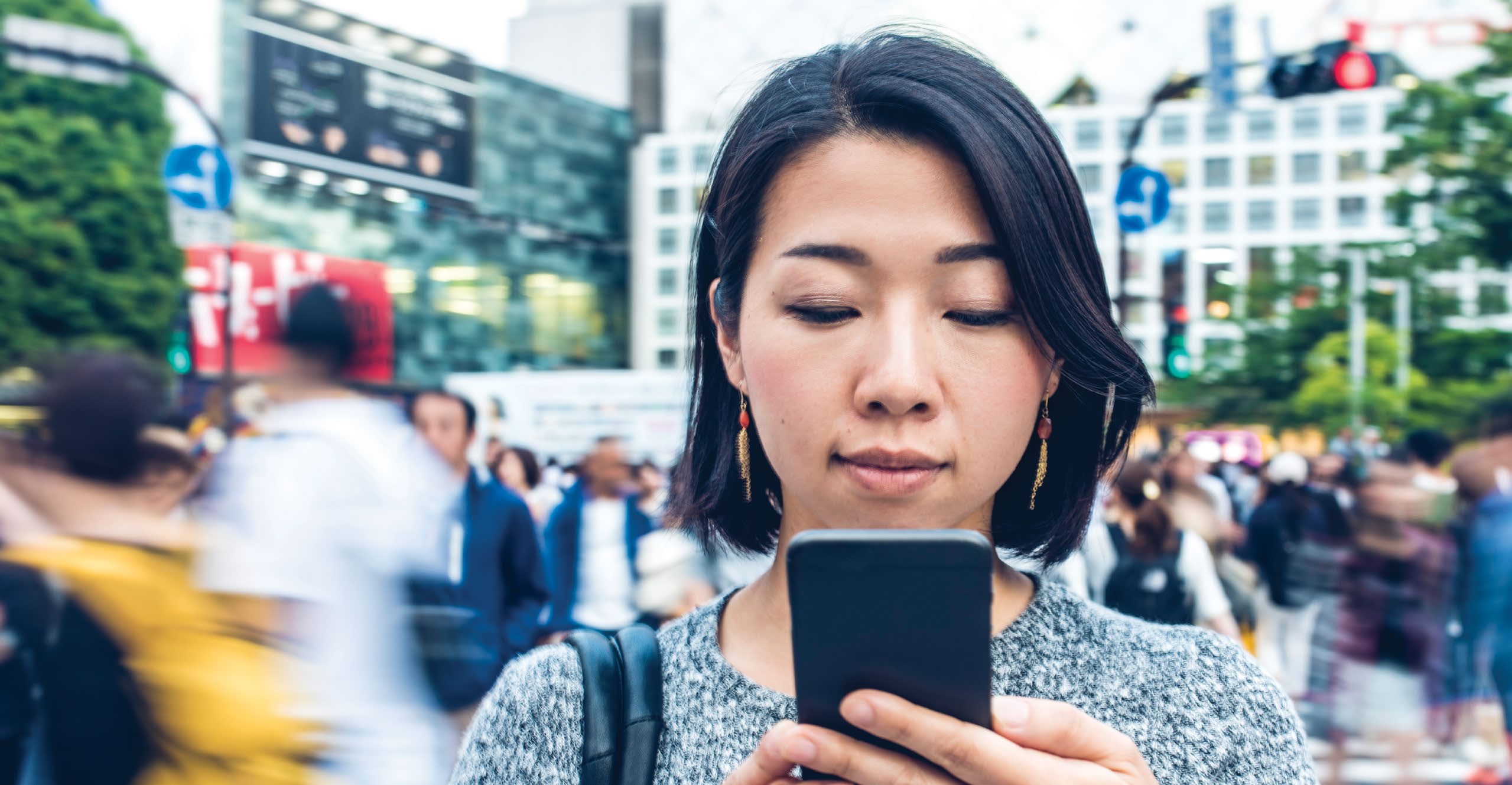 girl using phone in public